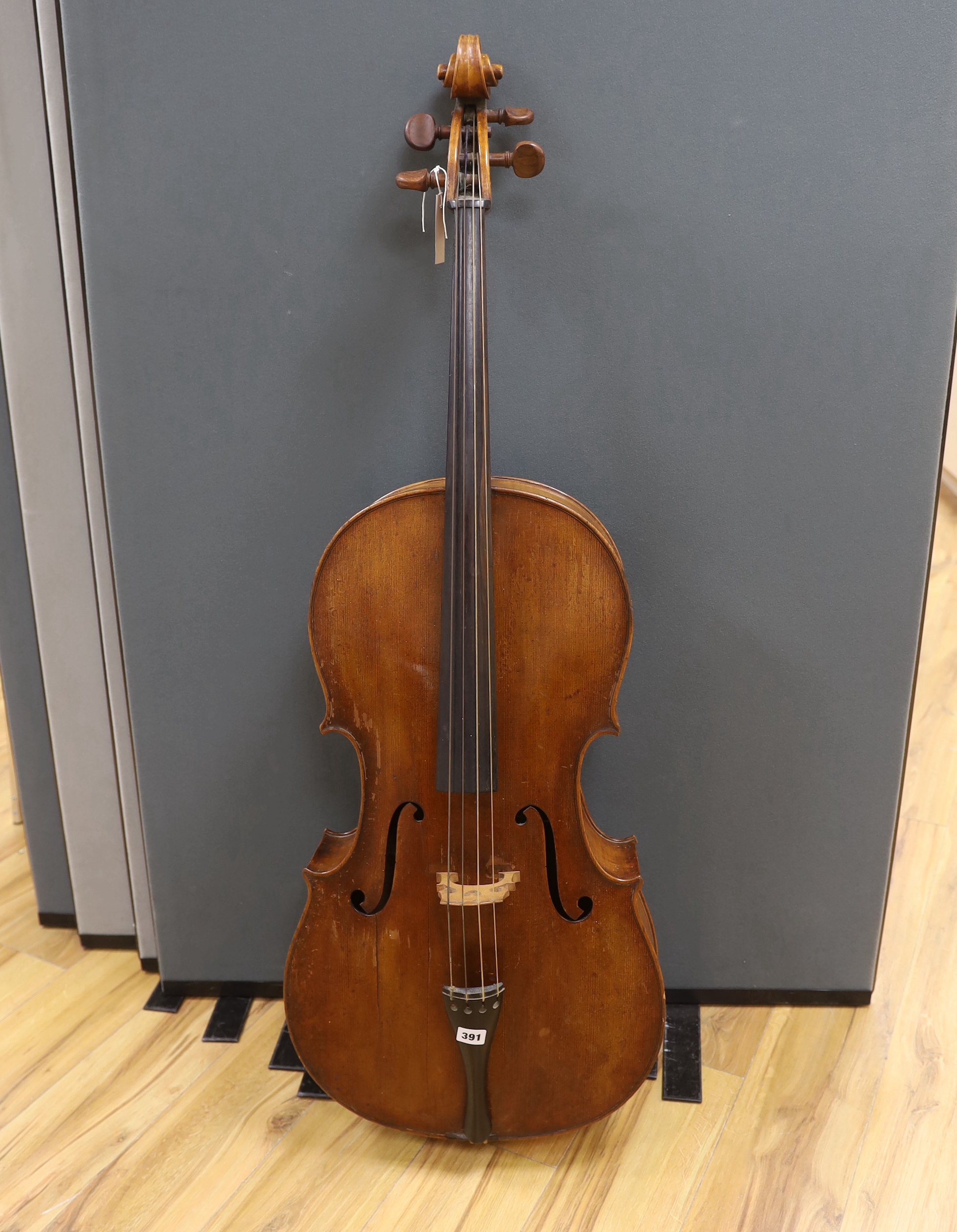 An early 20th century cello, back measures 76cm